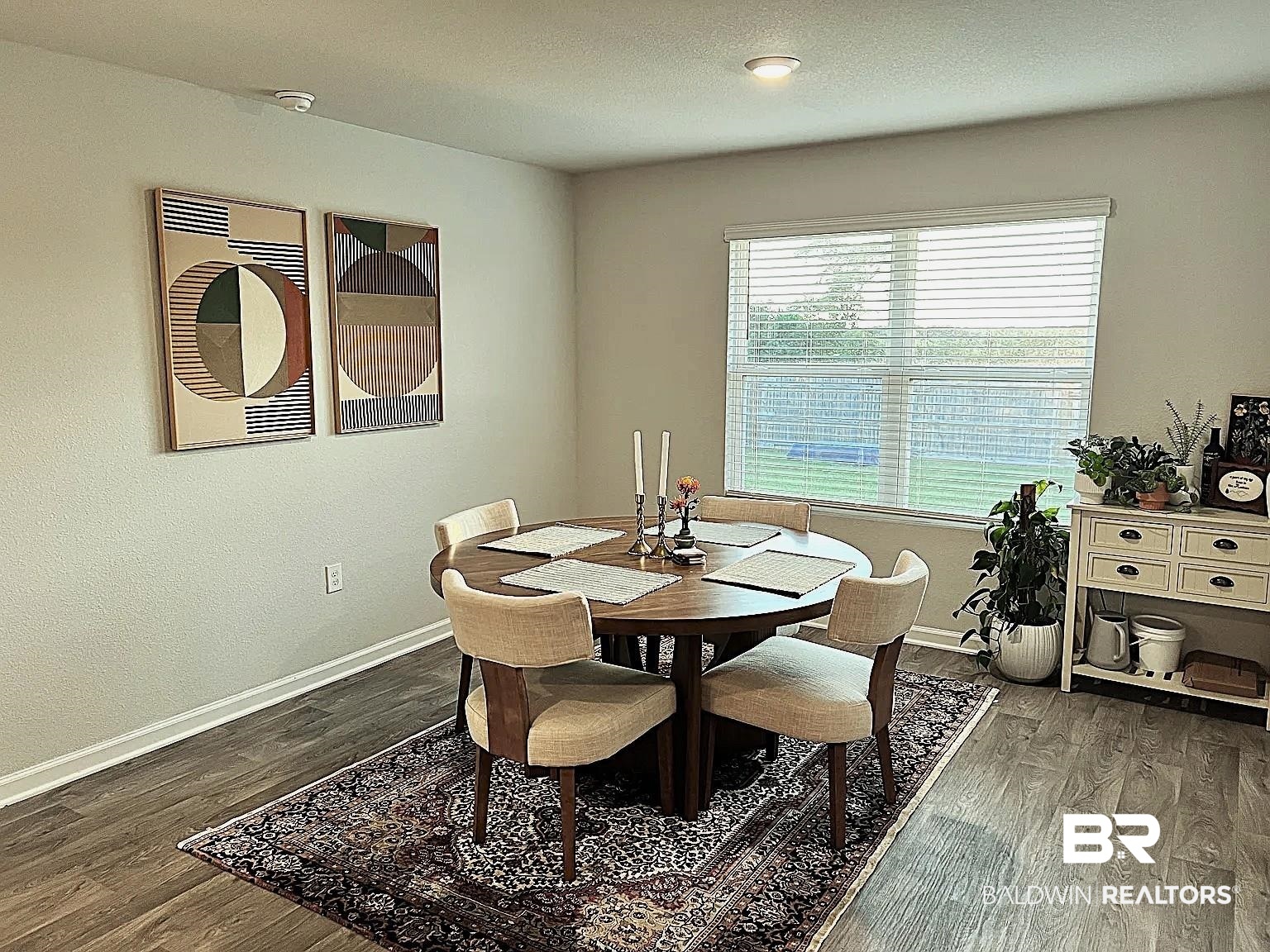 23915 Veranda Circle Elberta, AL 36530 - Photo 7 of 16 Dining room with dark wood finished floors and a textured ceiling
