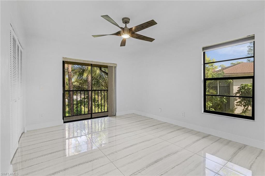 1765 Courtyard Way, Unit C202 Naples, FL 34112 - Photo 14 of 25 Unfurnished room with ceiling fan and baseboards