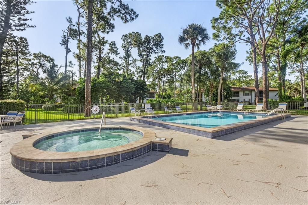 1765 Courtyard Way, Unit C202 Naples, FL 34112 - Photo 19 of 25 Community pool featuring a patio and a community hot tub