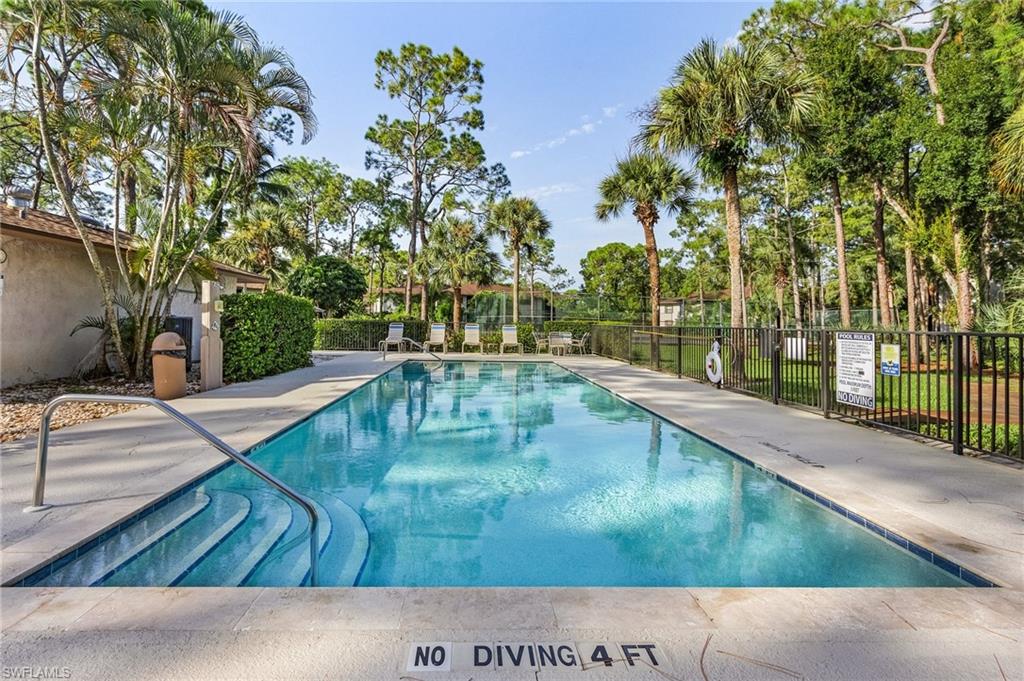 1765 Courtyard Way, Unit C202 Naples, FL 34112 - Photo 20 of 25 Community pool with a patio area
