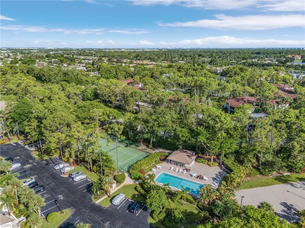 1765 Courtyard Way, Unit C202 Naples, FL 34112 - Photo 25 of 25 Drone / aerial view of a pool