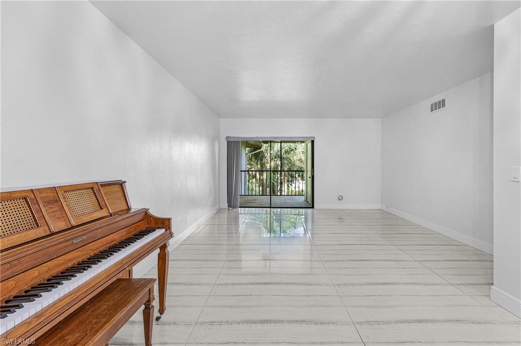 1765 Courtyard Way, Unit C202 Naples, FL 34112 - Photo 7 of 25 Unfurnished room with baseboards