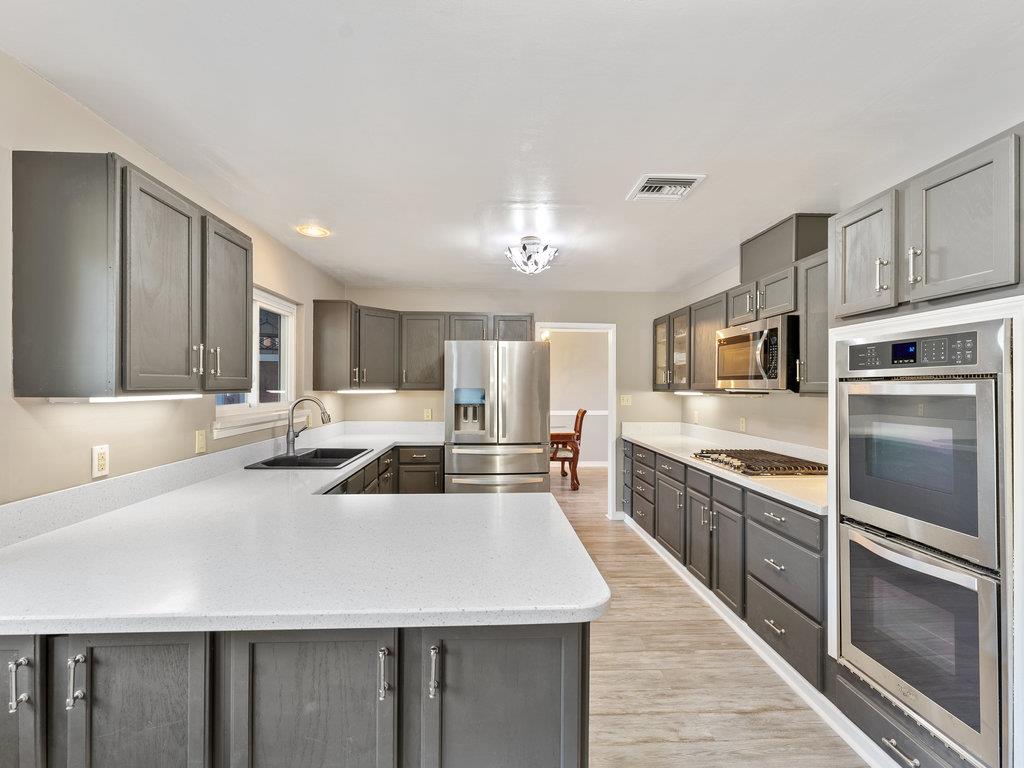 63155 Argyle Road King City, CA 93930 - Photo 15 of 46 a large kitchen with a large counter top stainless steel appliances and cabinets