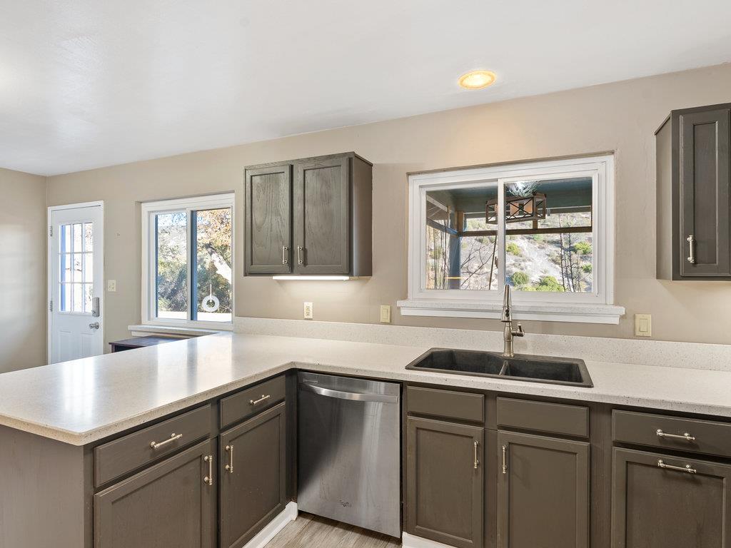 63155 Argyle Road King City, CA 93930 - Photo 18 of 46 a kitchen with a sink and large window