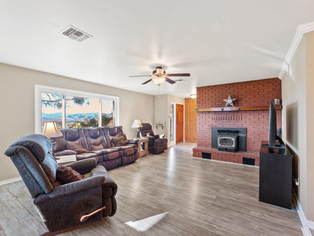 63155 Argyle Road King City, CA 93930 - Photo 19 of 46 a living room with furniture and a fireplace