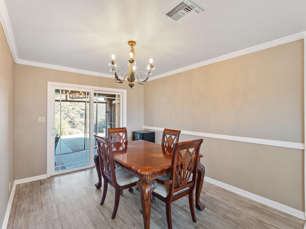 63155 Argyle Road King City, CA 93930 - Photo 22 of 46 a view of a dining room with furniture wooden floor and chandelier