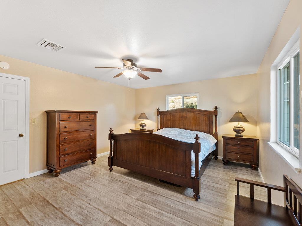 63155 Argyle Road King City, CA 93930 - Photo 29 of 46 a bedroom with a bed and wooden floor