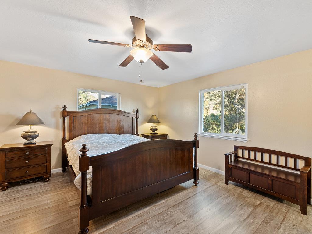 63155 Argyle Road King City, CA 93930 - Photo 30 of 46 a bedroom with a bed and wooden floor