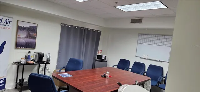 a view of a dining room with furniture