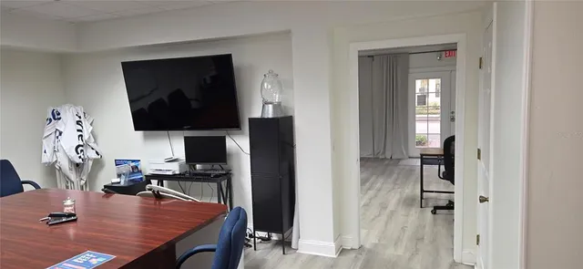 a room with furniture and flat screen tv