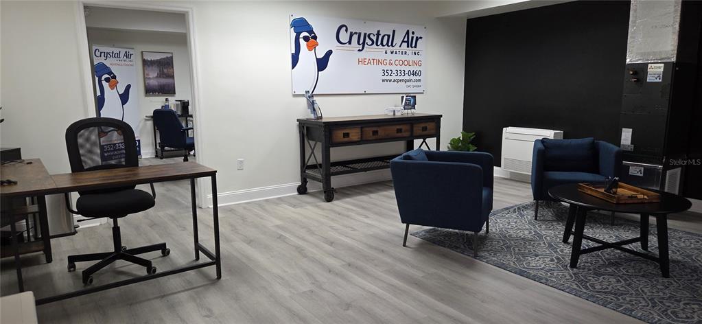 4936 Southwest 91 Terrace Gainesville, FL 32608 - Photo 8 of 11 a view of a workspace with furniture and a potted plant