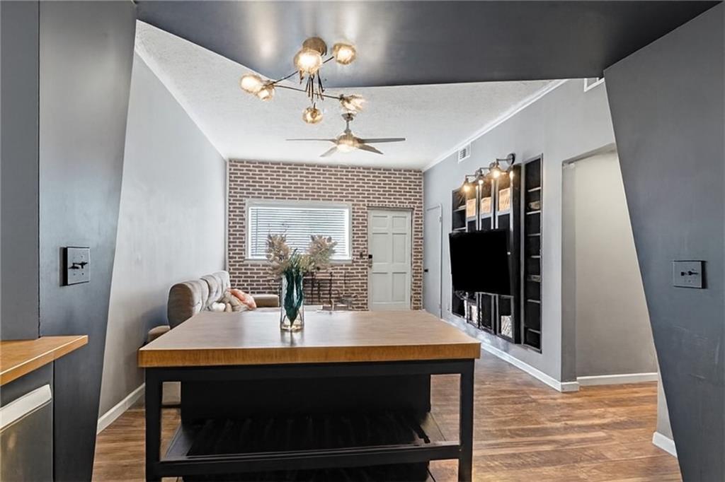 343 8th Street Northeast, Unit T1 Atlanta, GA 30309 - Photo 16 of 33 a view of a dining room with furniture and chandelier