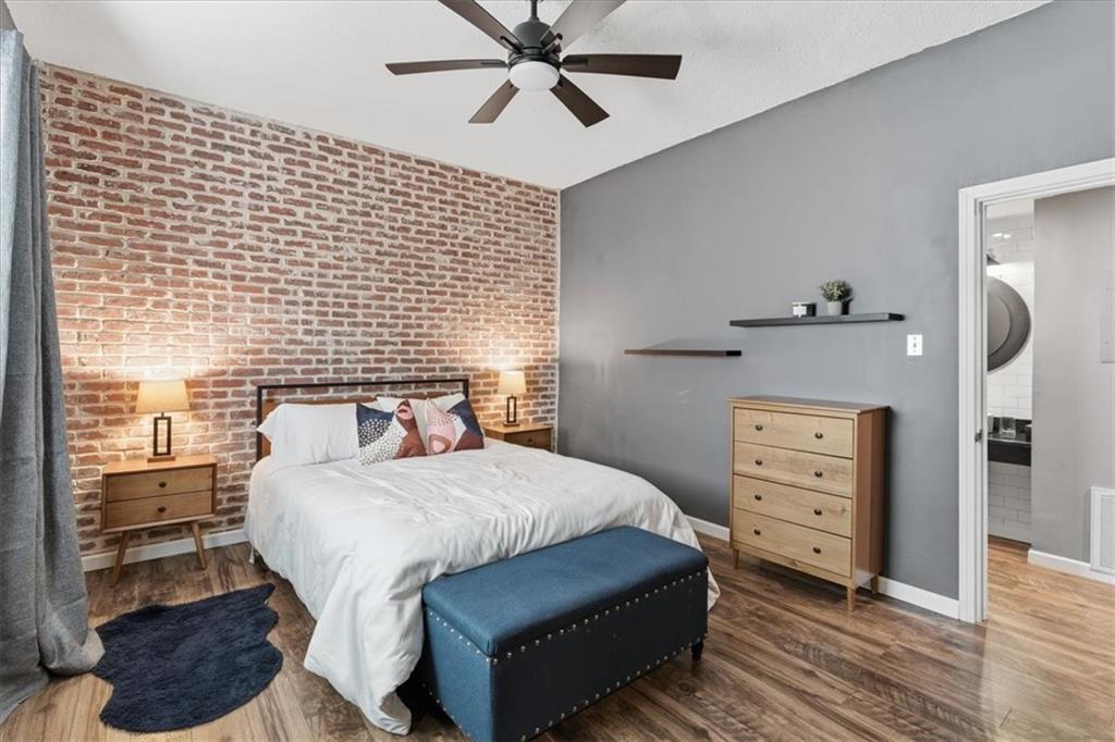 343 8th Street Northeast, Unit T1 Atlanta, GA 30309 - Photo 19 of 33 a bedroom with a bed and a dresser