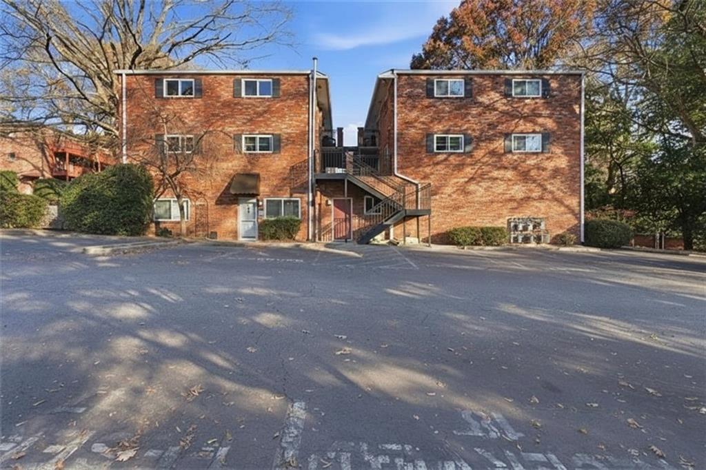 343 8th Street Northeast, Unit T1 Atlanta, GA 30309 - Photo 2 of 33 a view of a brick building next to a road