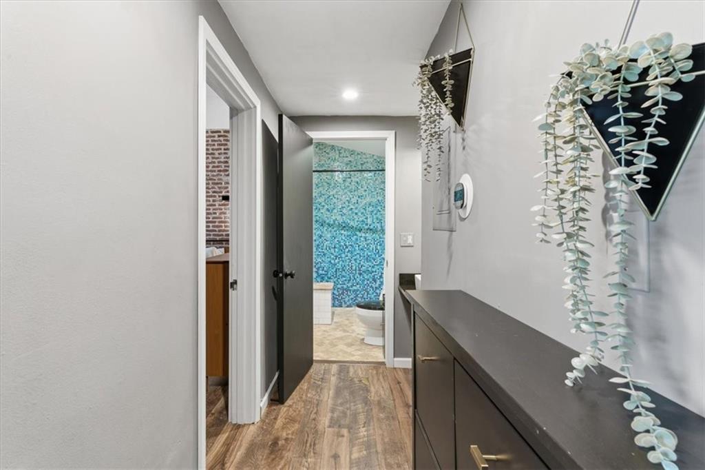 343 8th Street Northeast, Unit T1 Atlanta, GA 30309 - Photo 21 of 33 a view of hallway with window and wooden floor