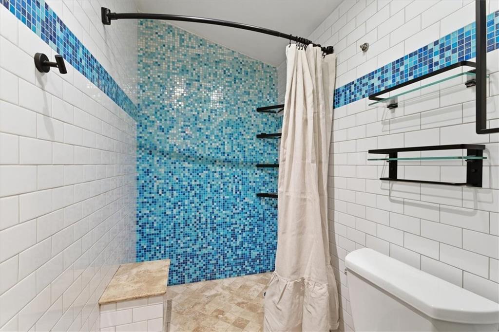 343 8th Street Northeast, Unit T1 Atlanta, GA 30309 - Photo 23 of 33 a bathroom with a toilet and shower