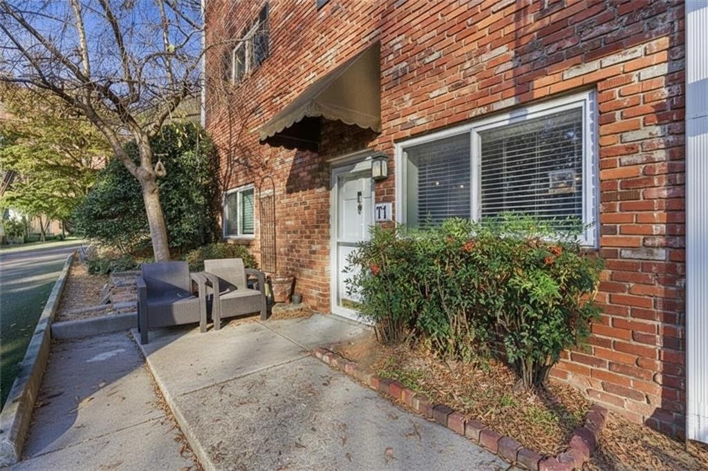 343 8th Street Northeast, Unit T1 Atlanta, GA 30309 - Photo 4 of 33 a view of a patio with couches and potted plants