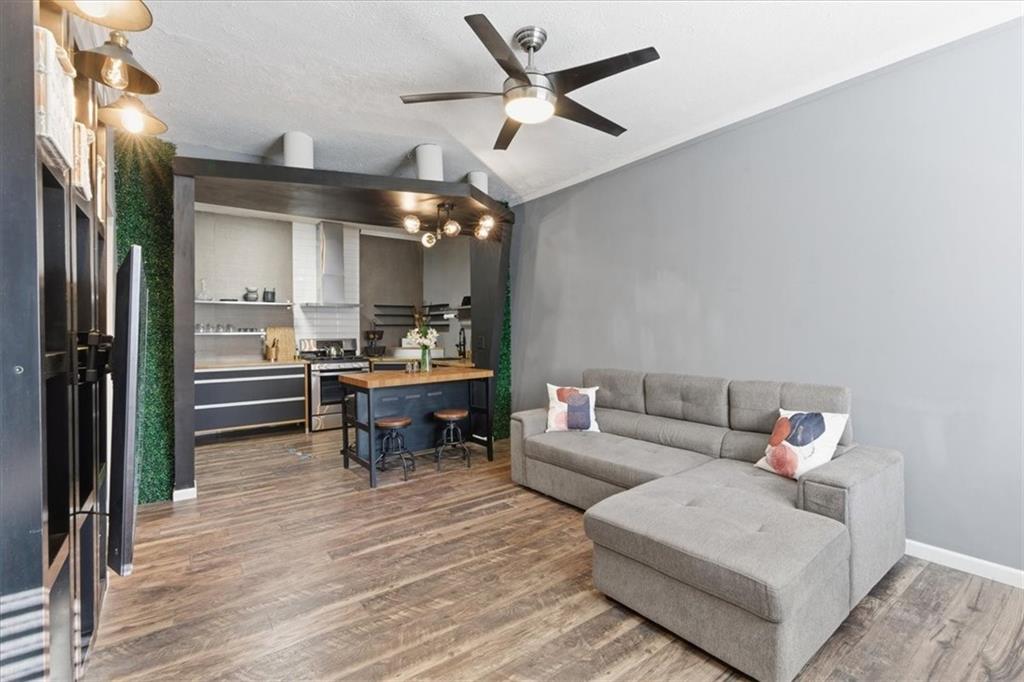 343 8th Street Northeast, Unit T1 Atlanta, GA 30309 - Photo 6 of 33 a living room with furniture and a wooden floor