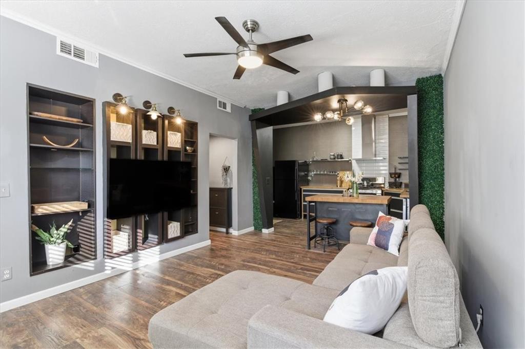 343 8th Street Northeast, Unit T1 Atlanta, GA 30309 - Photo 7 of 33 a living room with furniture and a flat screen tv