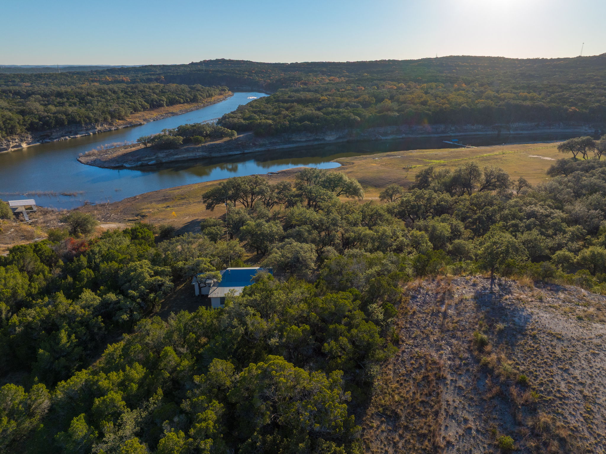 24105 Ranch To Market 1431 Marble Falls, TX 78654 - Photo 11 of 16 an aerial view of residential houses with outdoor space and river