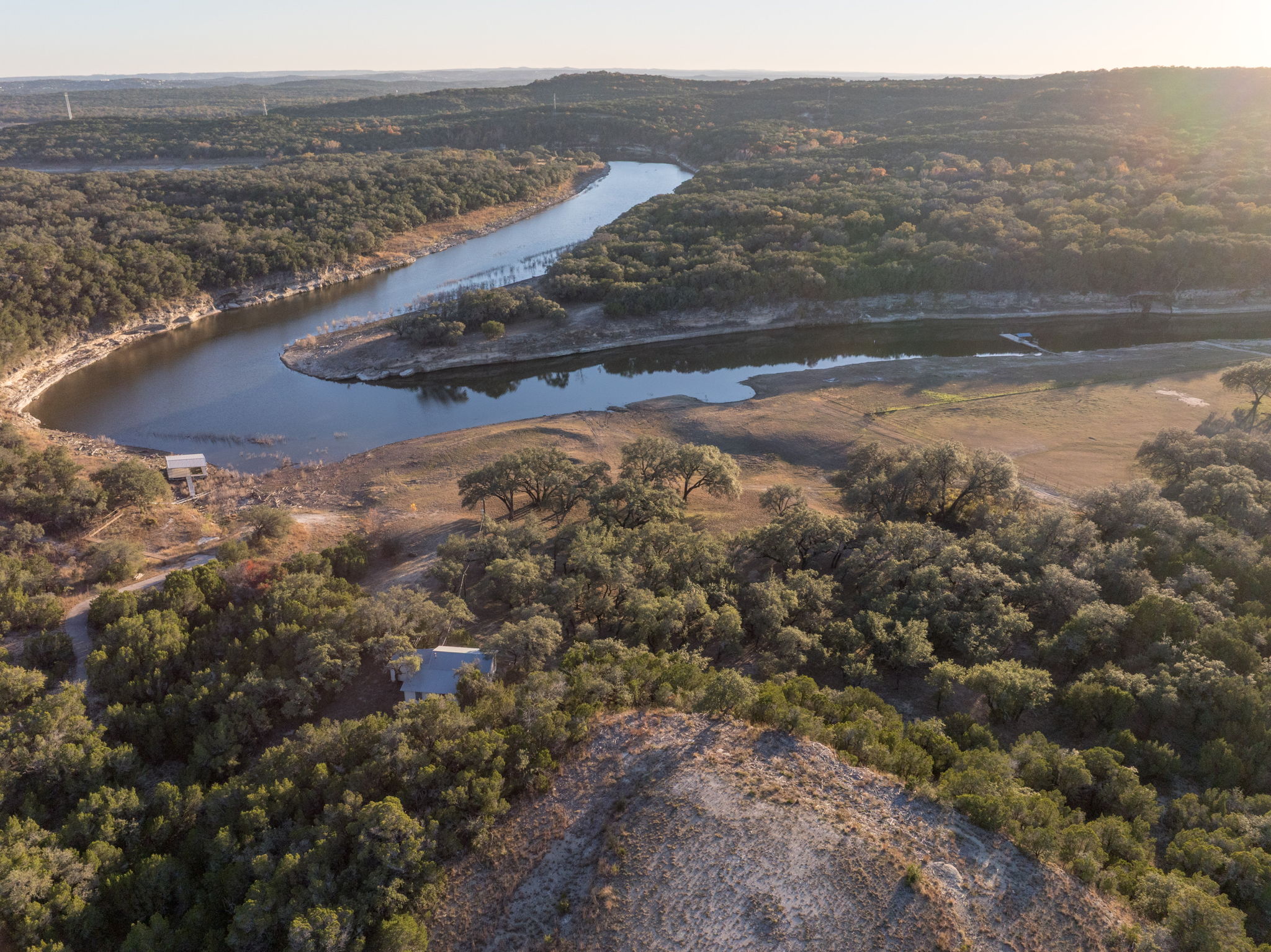 24105 Ranch To Market 1431 Marble Falls, TX 78654 - Photo 16 of 16 a view of a lake with mountains in the background