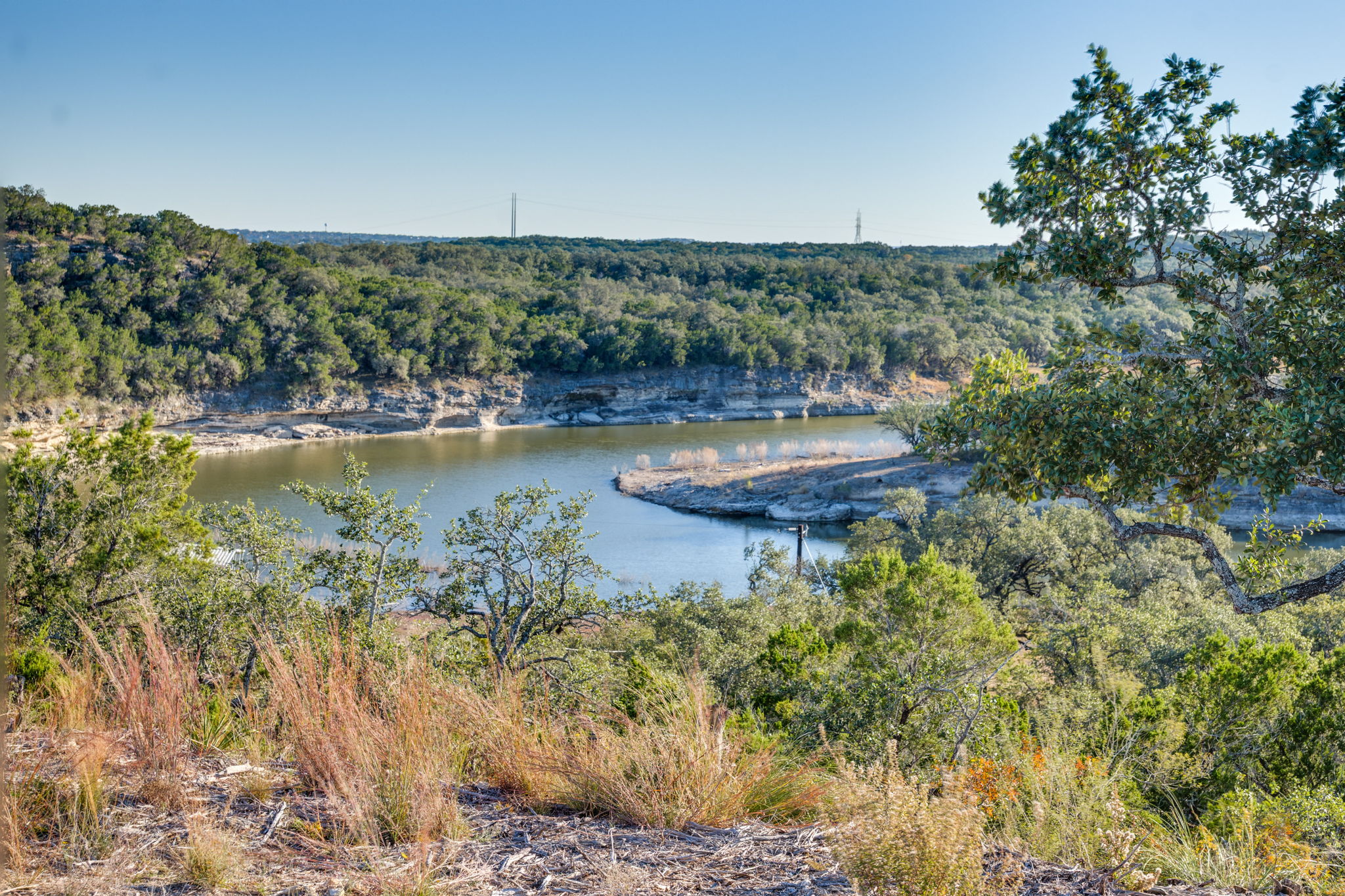 24105 Ranch To Market 1431 Marble Falls, TX 78654 - Photo 2 of 16 a view of a lake with houses in the back