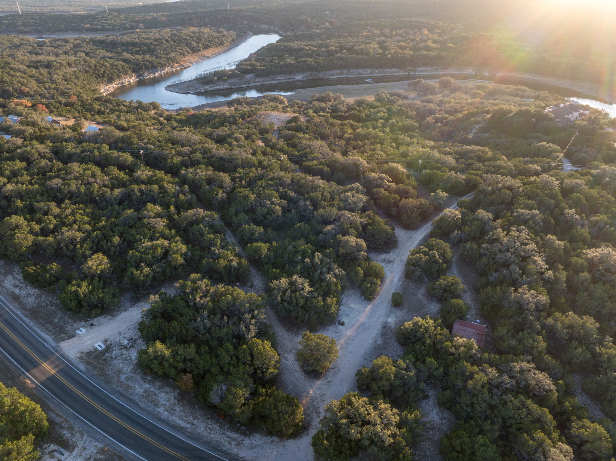 24105 Ranch To Market 1431 Marble Falls, TX 78654 - Photo 5 of 16 a view of a yard with plants and large trees