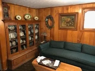 a bedroom with a bed and a chair