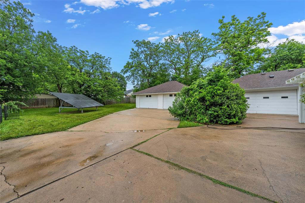3301 Loma Vista Drive Waco, TX 76708 - Photo 24 of 29 Concrete driveway leading to multiple garage doors