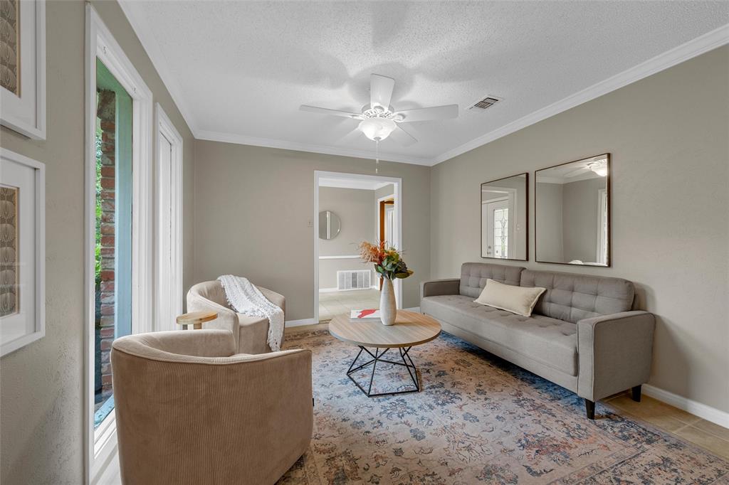 3301 Loma Vista Drive Waco, TX 76708 - Photo 3 of 29 Living area with neutral wall tones and crown molding