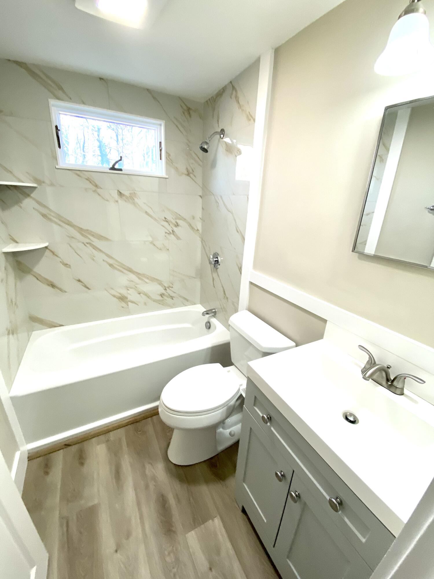 5 General Patton Drive Hyannis, MA 02601 - Photo 13 of 66 a bathroom with a sink a toilet and shower