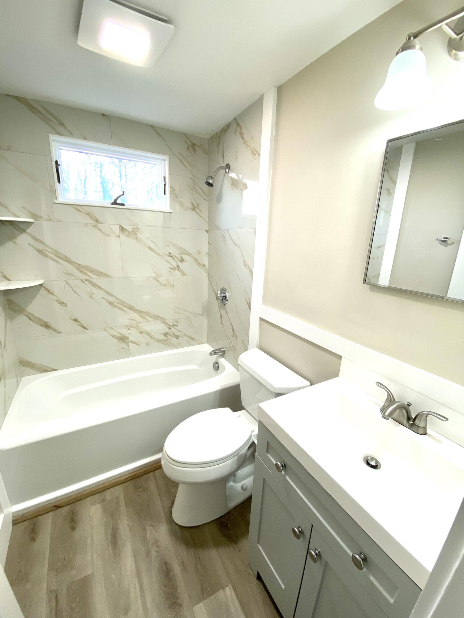 5 General Patton Drive Hyannis, MA 02601 - Photo 15 of 66 a bathroom with a sink a toilet and shower