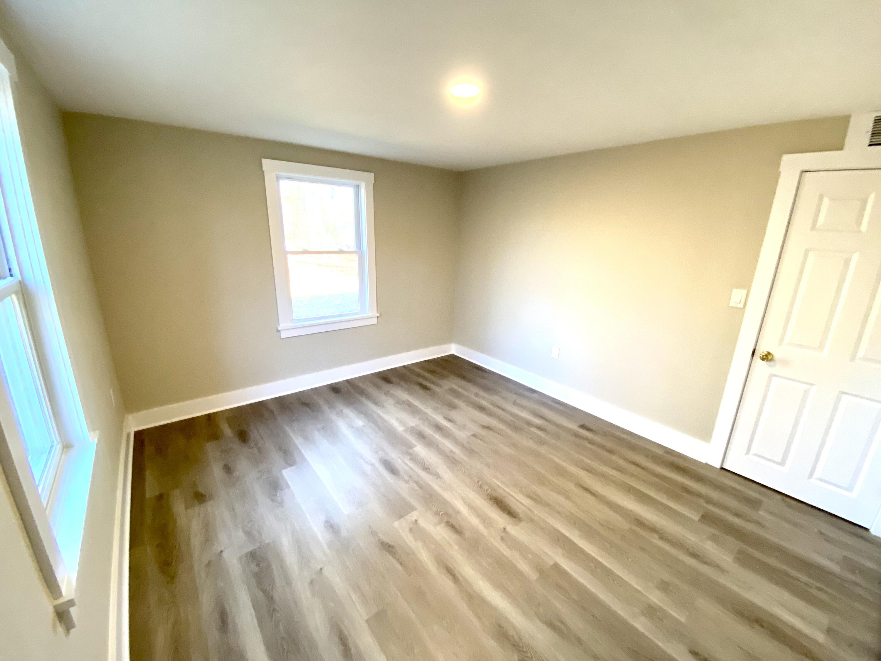 5 General Patton Drive Hyannis, MA 02601 - Photo 19 of 66 a view of an empty room and wooden floor