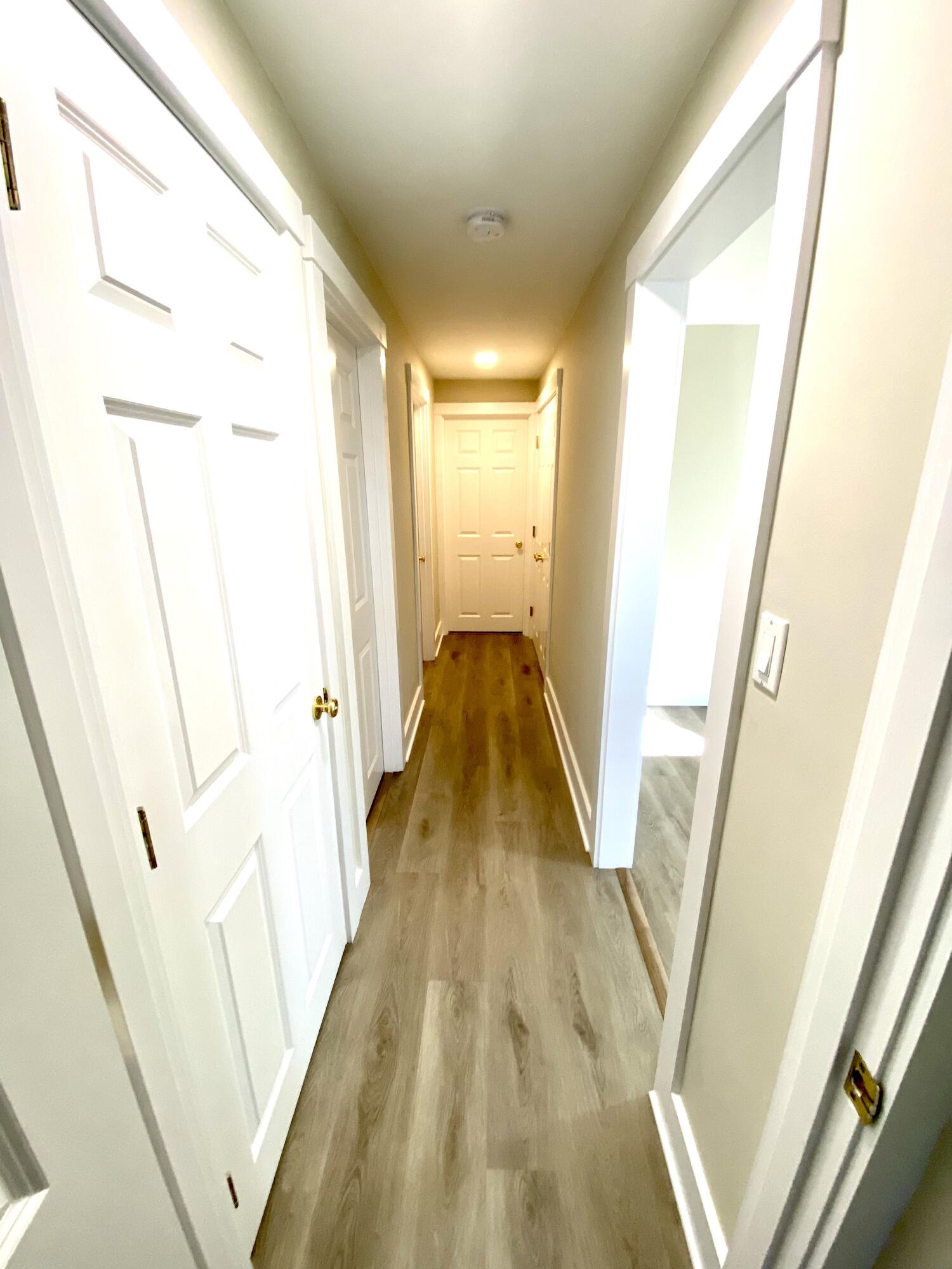 5 General Patton Drive Hyannis, MA 02601 - Photo 26 of 66 a view of a hallway with wooden floor and staircase