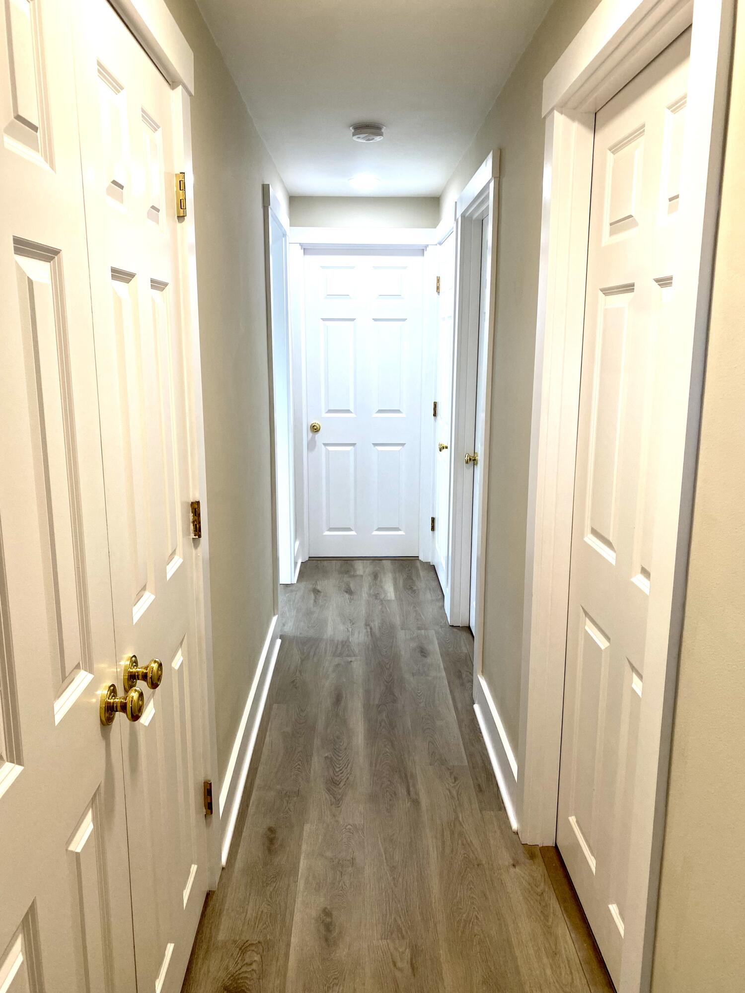 5 General Patton Drive Hyannis, MA 02601 - Photo 29 of 66 a view of a hallway with wooden floor and staircase