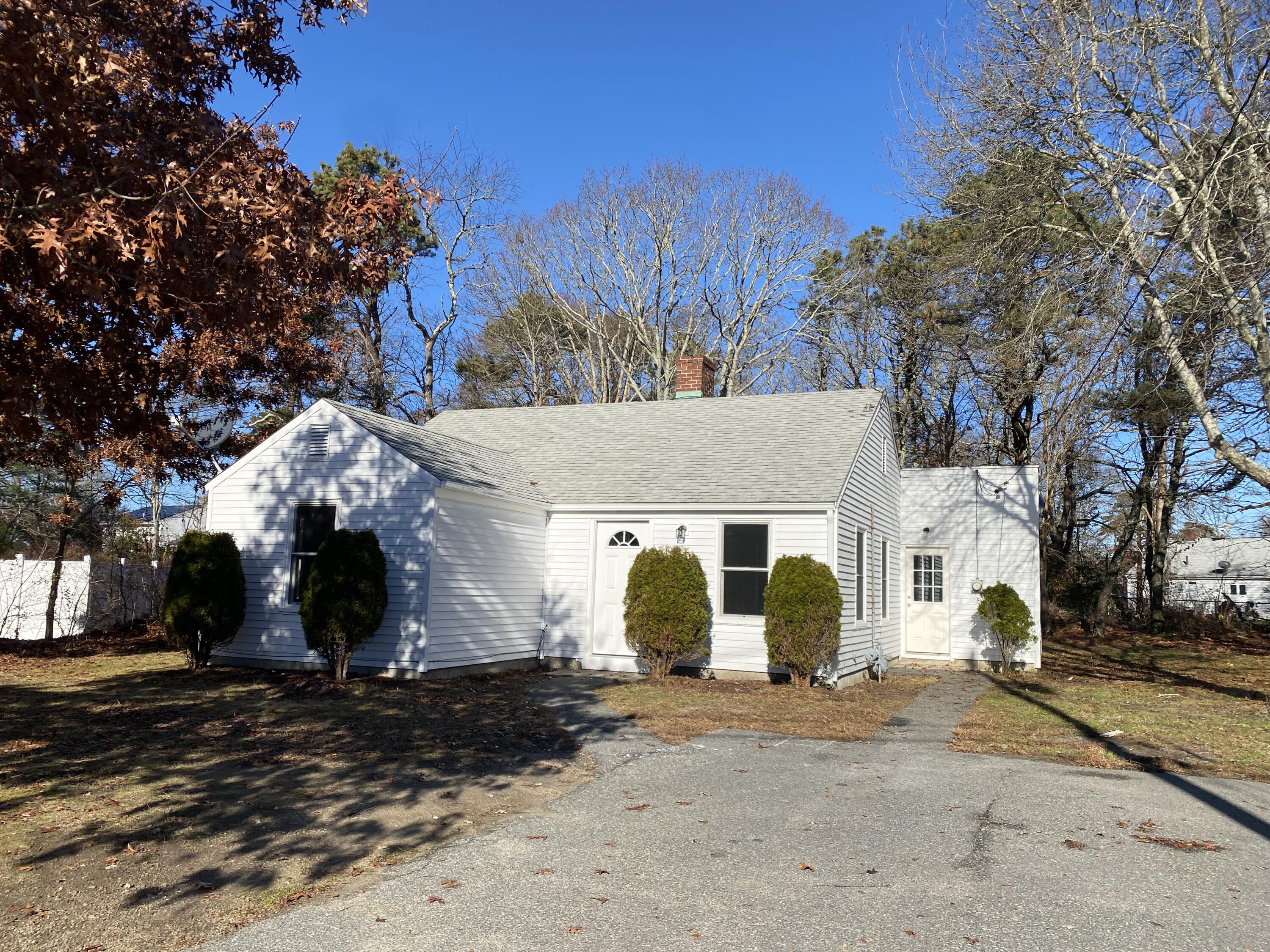 5 General Patton Drive Hyannis, MA 02601 - Photo 38 of 66 a view of a white house with a road