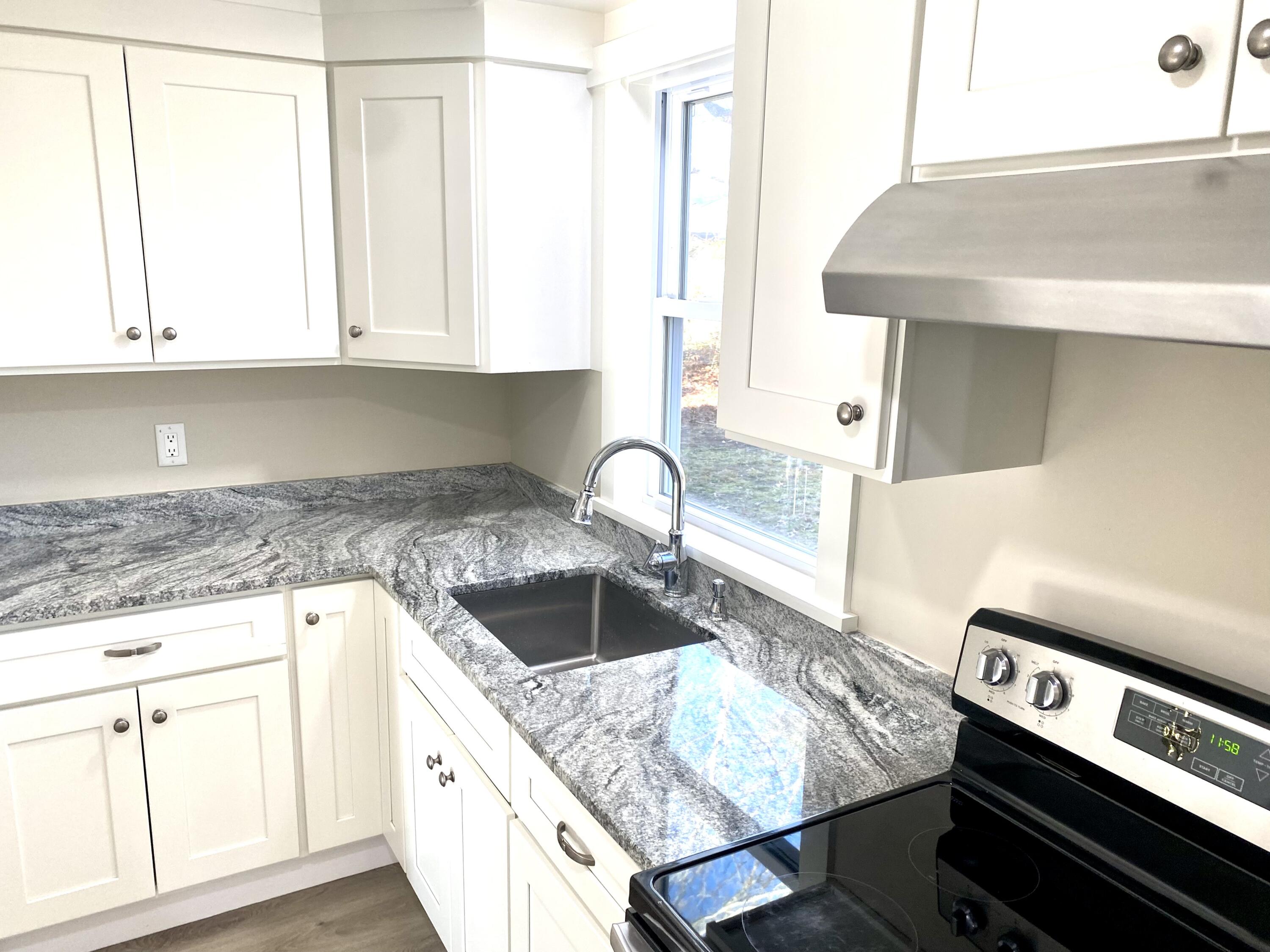 5 General Patton Drive Hyannis, MA 02601 - Photo 4 of 66 a kitchen with a sink and cabinets