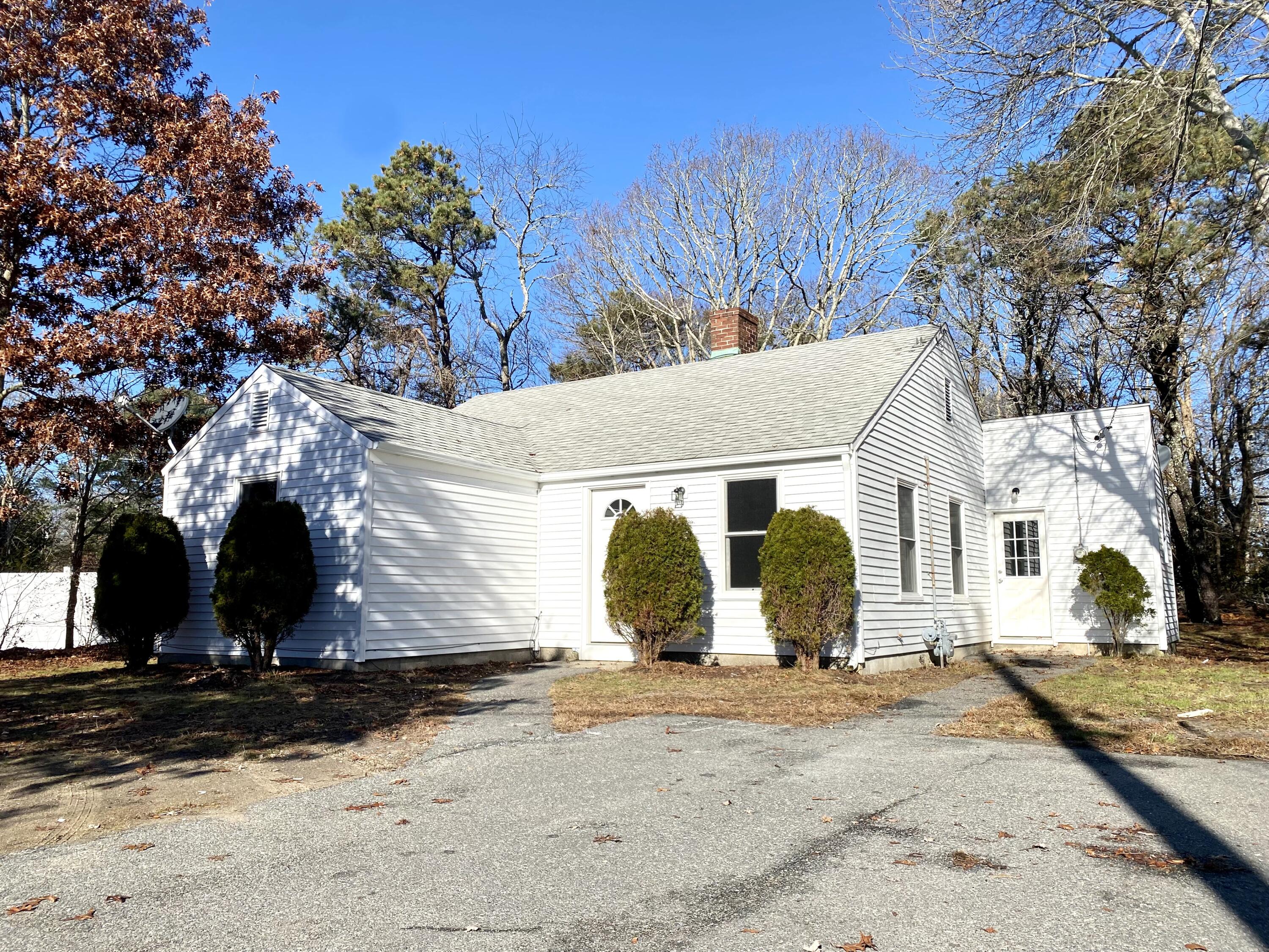 5 General Patton Drive Hyannis, MA 02601 - Photo 42 of 66 a front view of a house with a yard