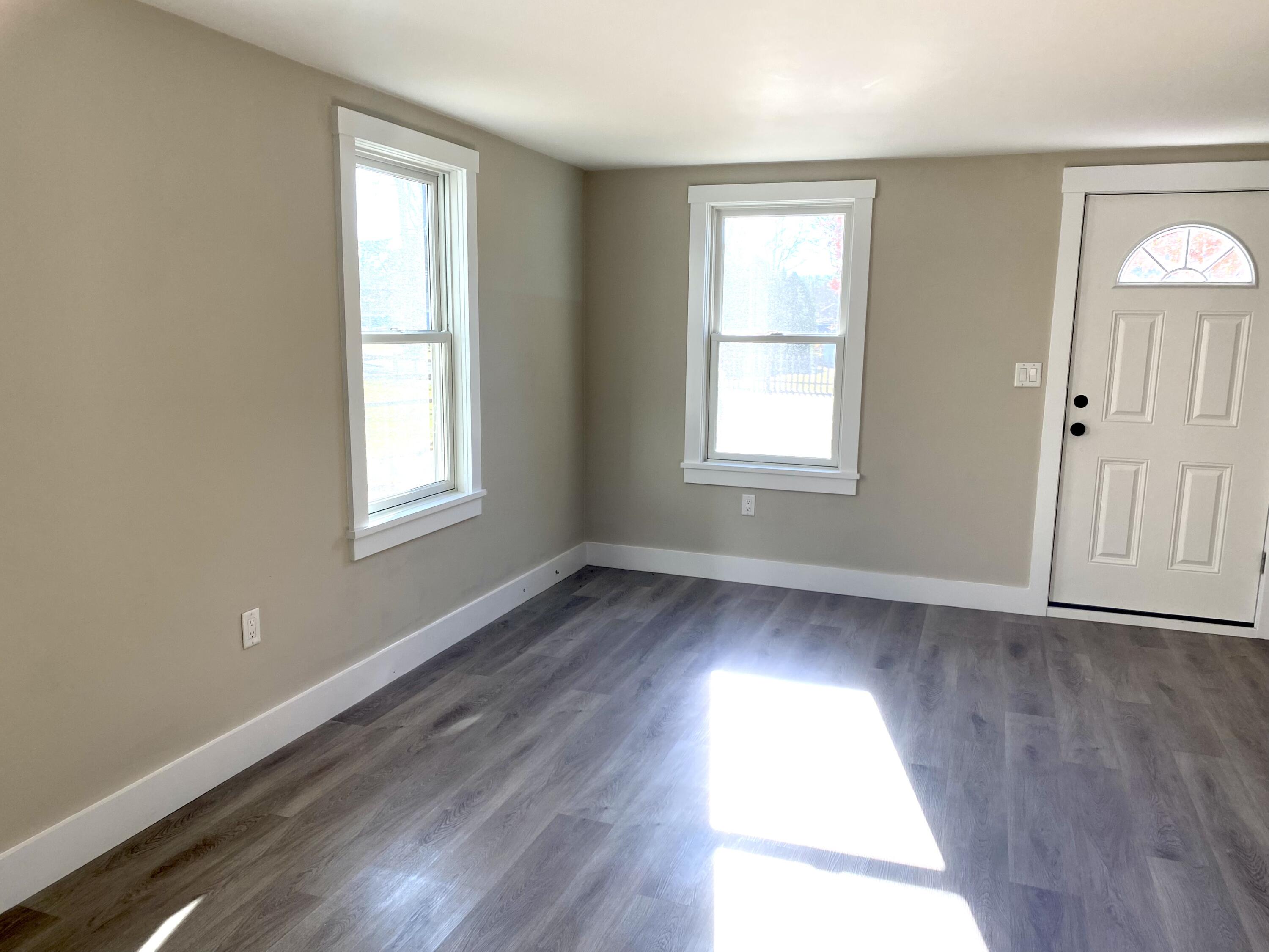 5 General Patton Drive Hyannis, MA 02601 - Photo 50 of 66 an empty room with wooden floor and windows
