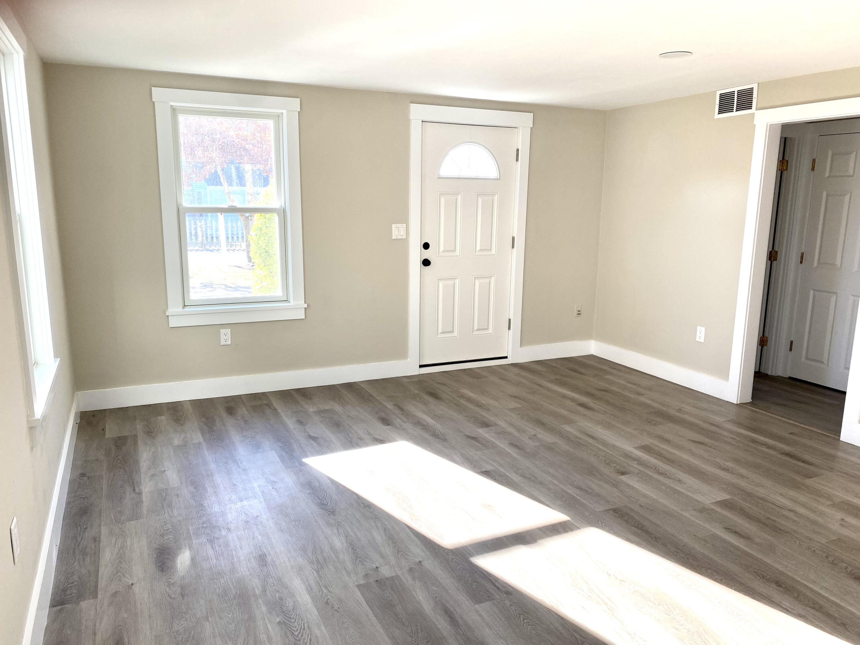 5 General Patton Drive Hyannis, MA 02601 - Photo 51 of 66 an empty room with wooden floor and windows