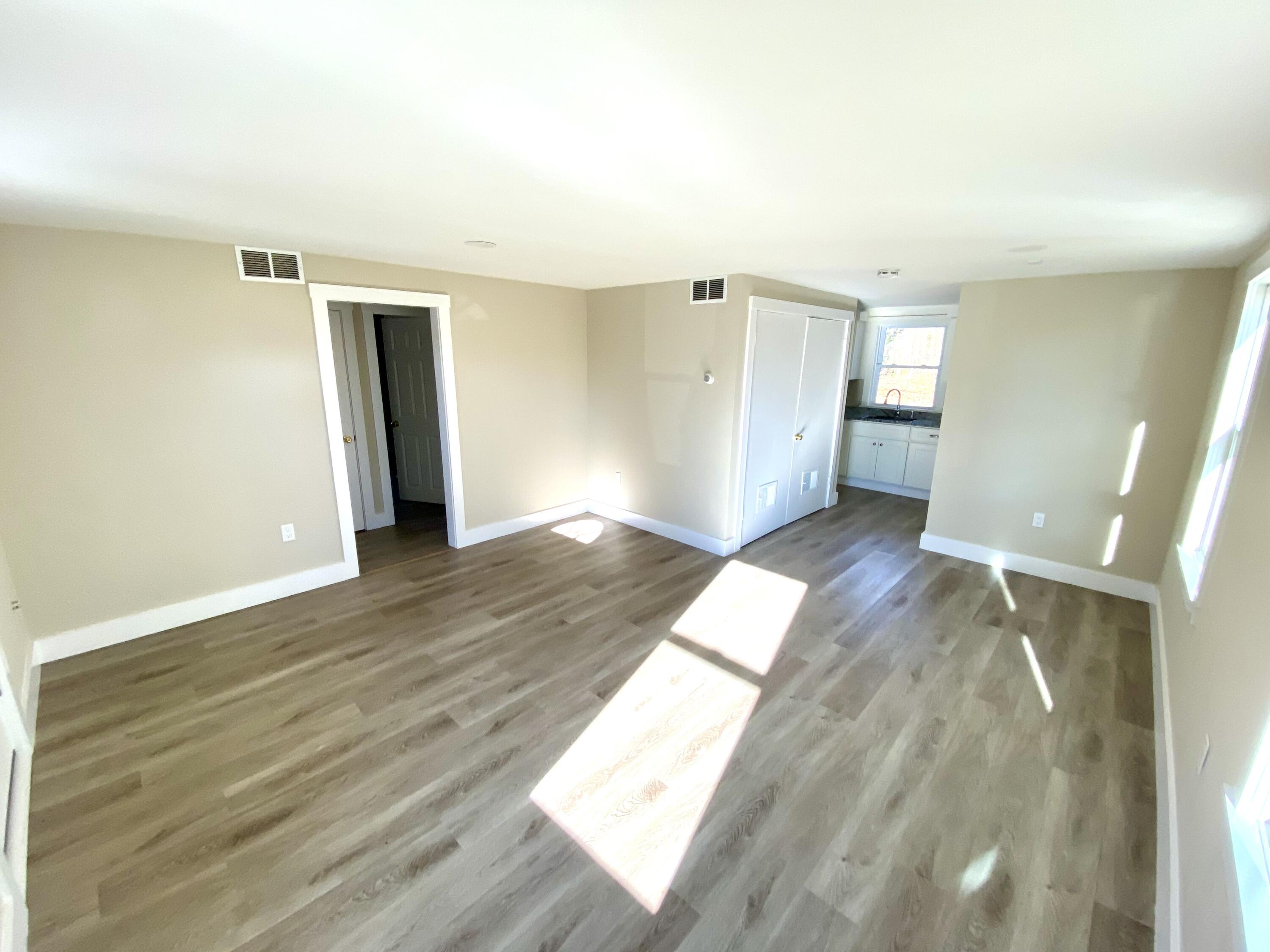 5 General Patton Drive Hyannis, MA 02601 - Photo 53 of 66 an empty room with wooden floor and windows