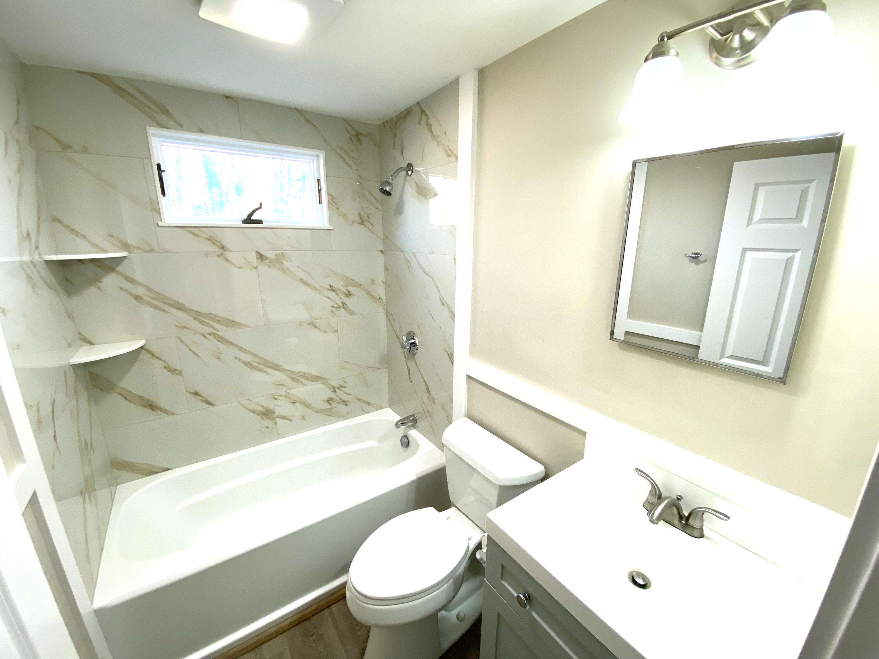 5 General Patton Drive Hyannis, MA 02601 - Photo 57 of 66 a bathroom with a sink a toilet and shower