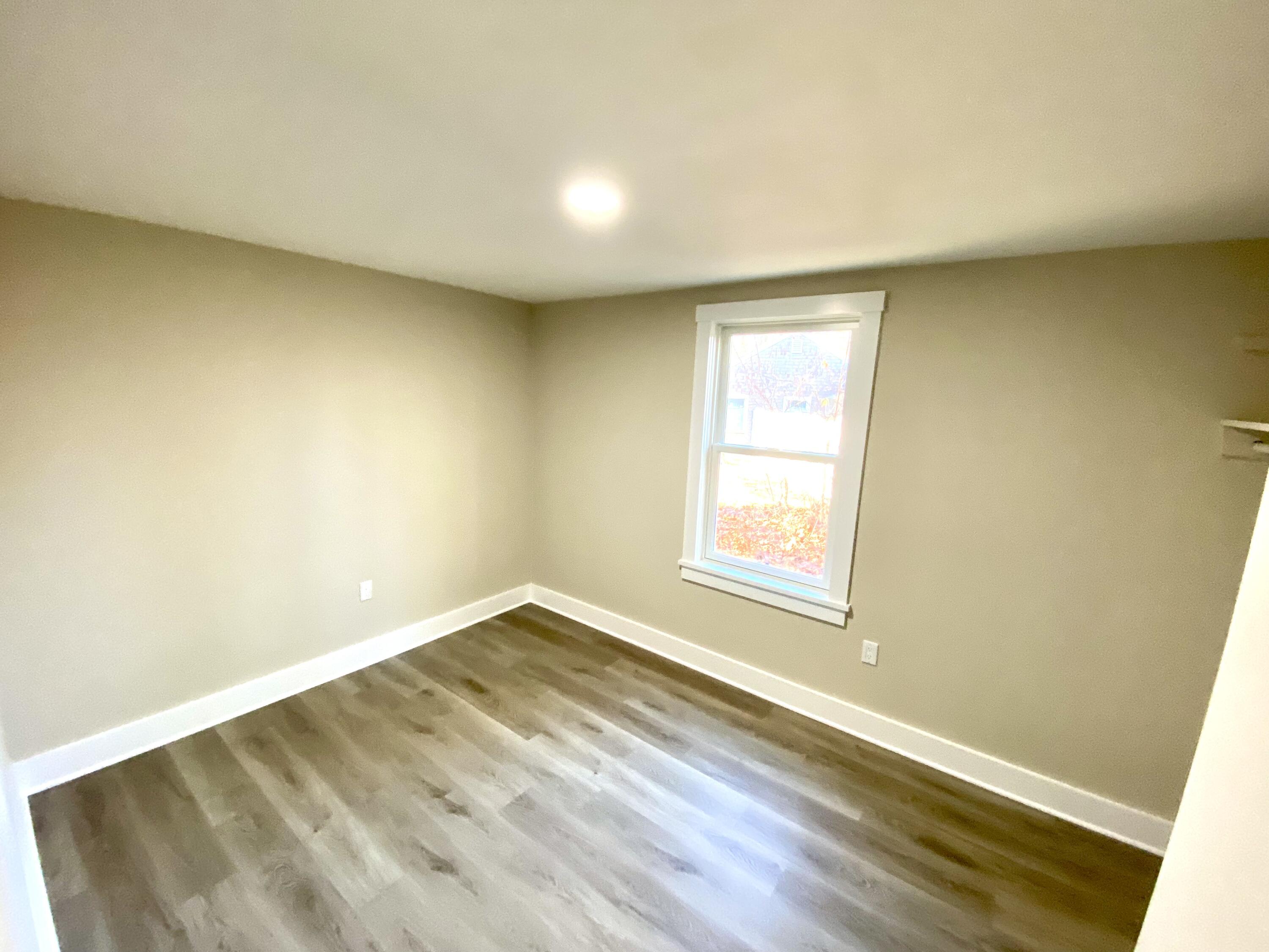 5 General Patton Drive Hyannis, MA 02601 - Photo 58 of 66 an empty room with wooden floor and windows