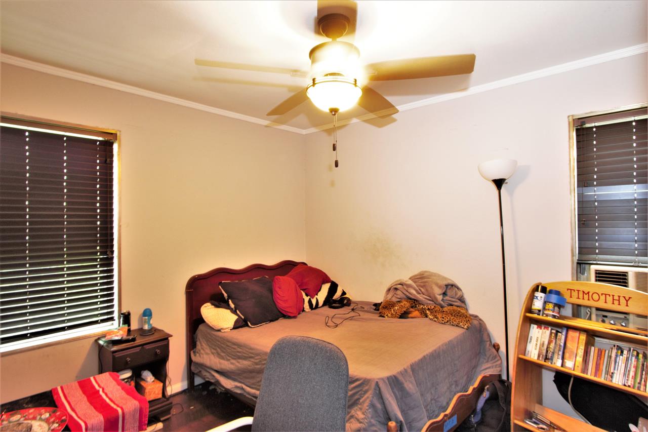 1783 Sea Isle Road Memphis, TN 38117 - Photo 11 of 20 a bedroom with furniture and a chandelier