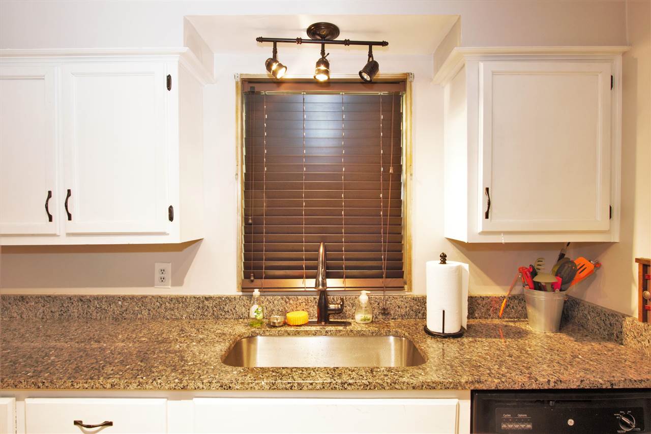 1783 Sea Isle Road Memphis, TN 38117 - Photo 4 of 20 a bathroom with a granite countertop sink and a mirror