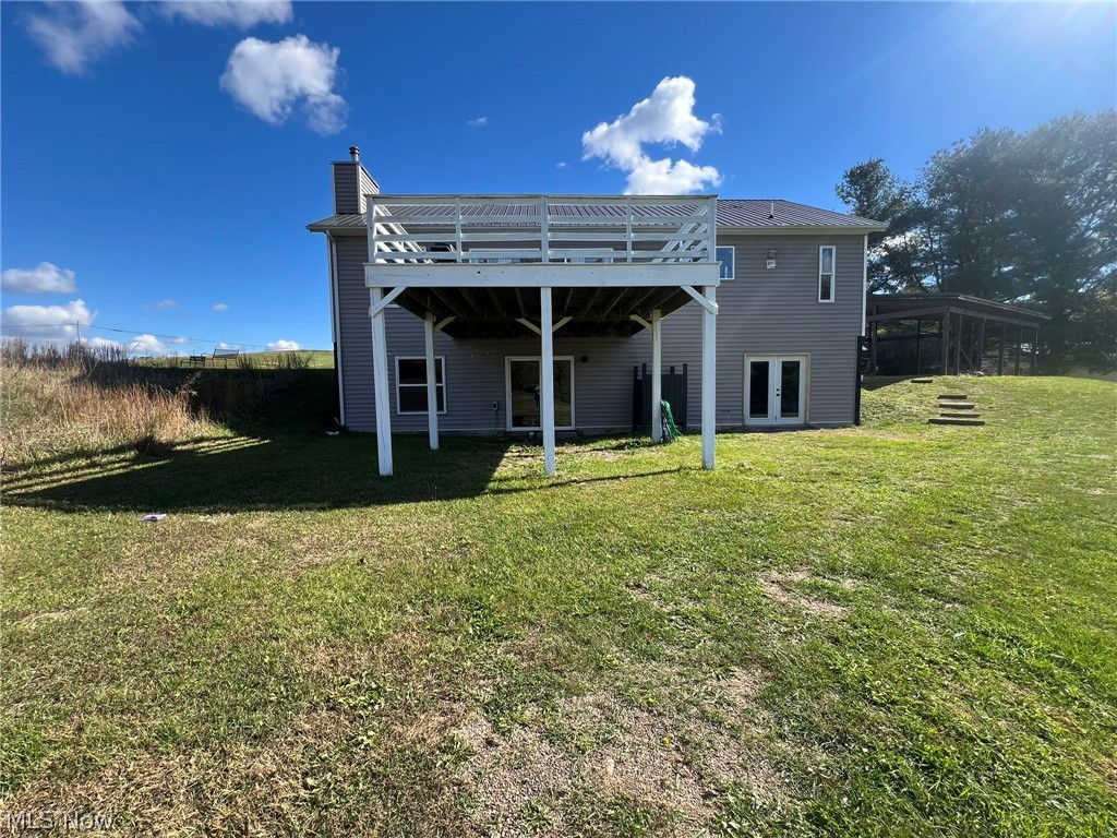15393 Shade Road Guysville, OH 45735 - Photo 33 of 35 Expansive green space featuring a two-story deck with pergola, lower-level patio access, and a separate covered structure