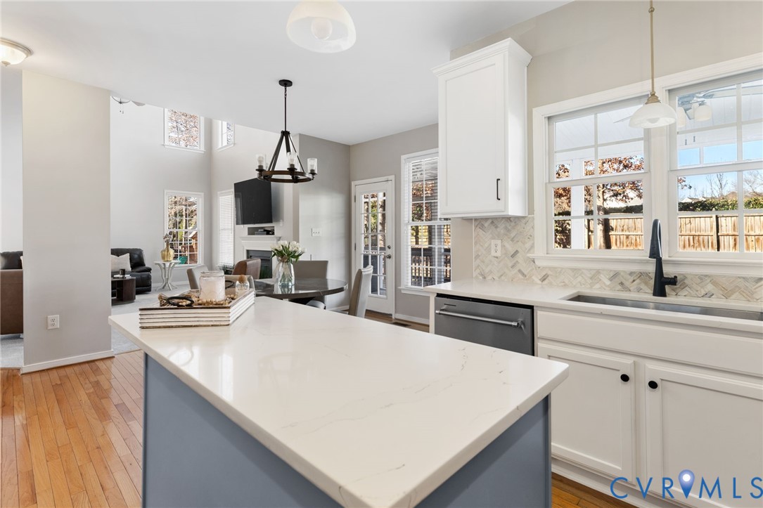 12008 Wheat Ridge Court Glen Allen, VA 23059 - Photo 18 of 36 a kitchen with stainless steel appliances a sink stove and refrigerator