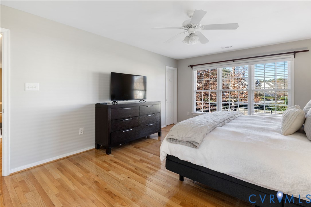 12008 Wheat Ridge Court Glen Allen, VA 23059 - Photo 26 of 36 a bedroom with a bed and a flat screen tv