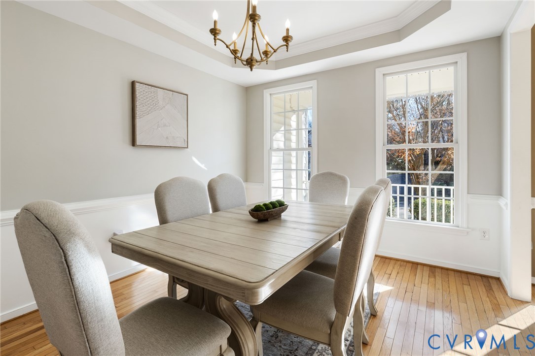 12008 Wheat Ridge Court Glen Allen, VA 23059 - Photo 7 of 36 a view of a dining room with furniture window and wooden floor