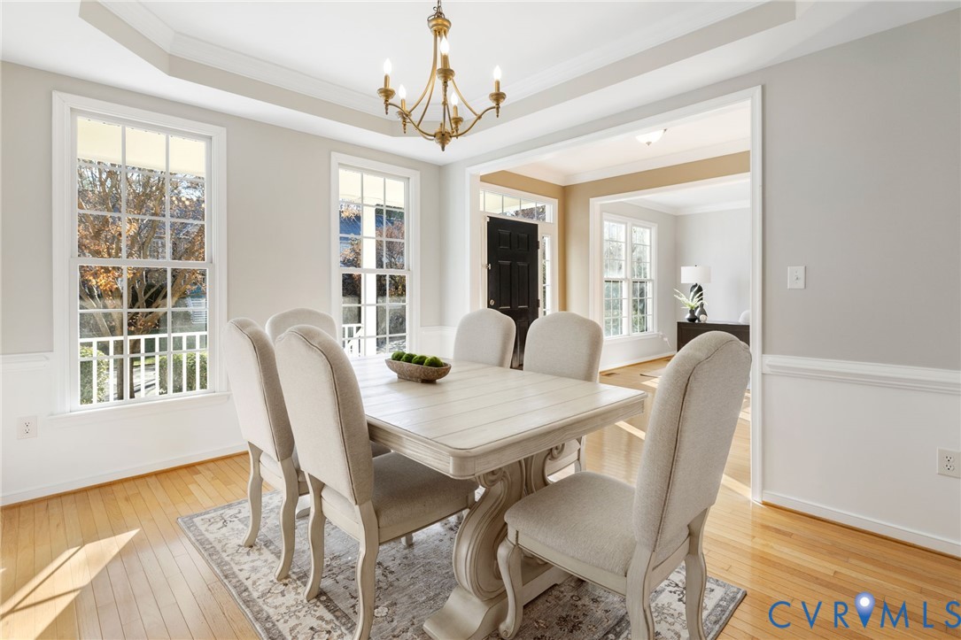 12008 Wheat Ridge Court Glen Allen, VA 23059 - Photo 8 of 36 a view of a dining room with furniture and wooden floor